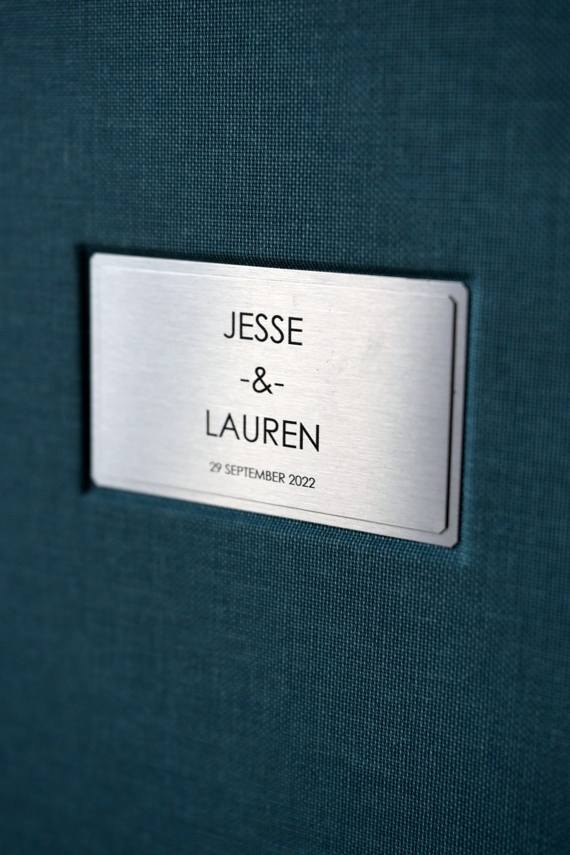 Brushed metal plate engraved with names and date